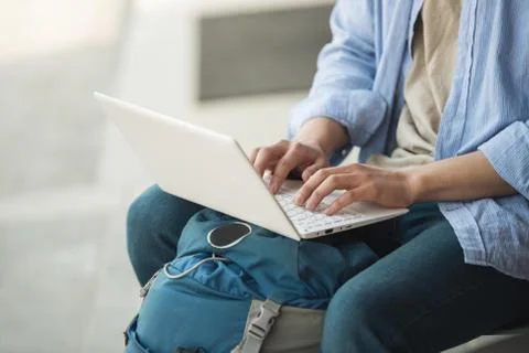 Asian man backpacking using laptop Stock Photos