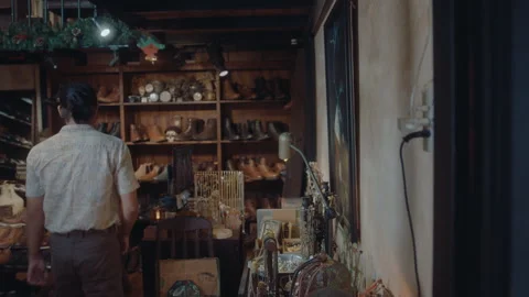 Asian Man Beginning Workday in Antique Shop Stock Footage 242466482