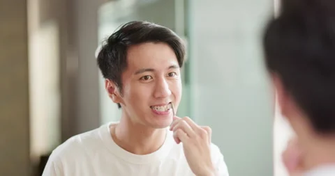 Asian man brushing teeth Stock Footage 224685317