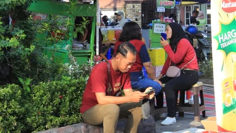 Asian man is busy replying to chat Stock Footage 286289440