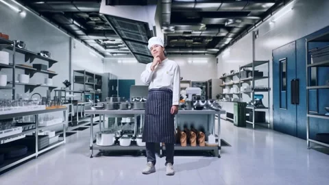 Asian Man Chef Thinking About Something And Looking Around In Kitchen Stock Footage 273244631
