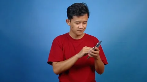 Asian man cleaning smartphone screen Stock Footage 327169191