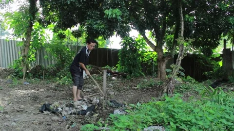 An Asian man cleans the trash with a fork Video stock 201319244