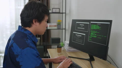 Asian man coding and programming on screen desktop. Stock Footage 203913820
