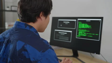 Asian man coding and programming on screen desktop. Stock Footage 203913871