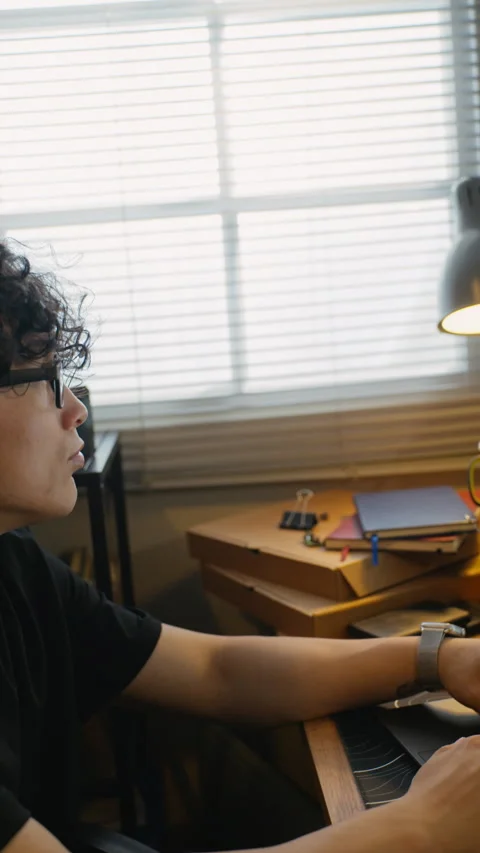 Asian Man Coding and Waiting for Progress Bar Loading on Screen Stock-Footage 338424913