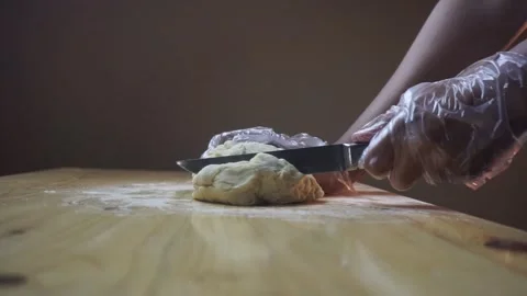 Asian man cutting bread dough wearing plastic gloves Stock Footage 271147026