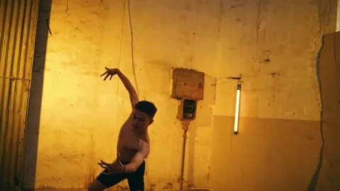 an Asian man dancing with hand gestures ... | Stock Video | Pond5