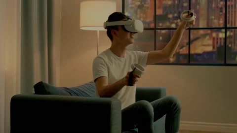 Asian man developer in virtual reality headset moves hands 스톡 동영상 158117449