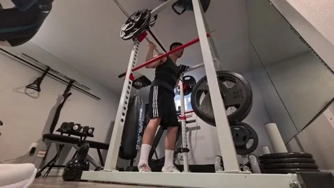 Asian man doing a back squat exercise Portland OR USA June 23 2025 Stock-Footage 311831354