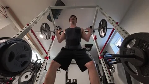 Asian man doing a back squat exercise Portland OR USA June 23 2025 Stock-Footage 311831355