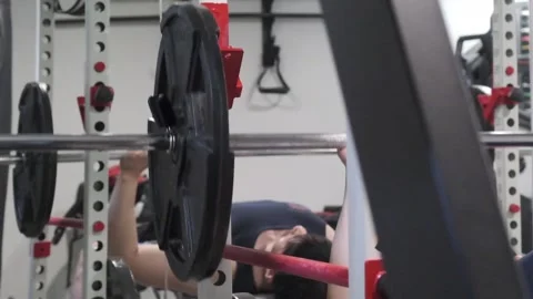 Asian man doing a bench press Portland OR USA June 20th 2025 Stock-Footage 311678730