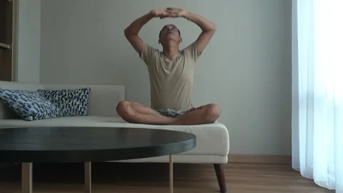 Asian man doing an exercise in the living room Video stock 226942138