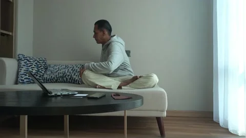 Asian man doing an exercise in the living room Stock Footage 226944449