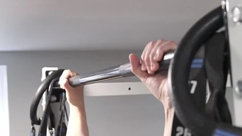 Asian man doing a pull up close up Portland OR USA June 20 2025 Stock Footage 311678725