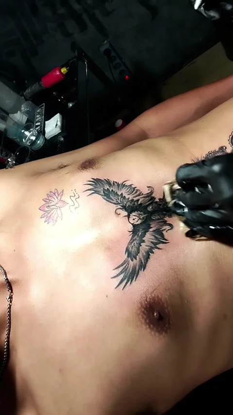 An asian man doing tattoo Stock Footage 342310229