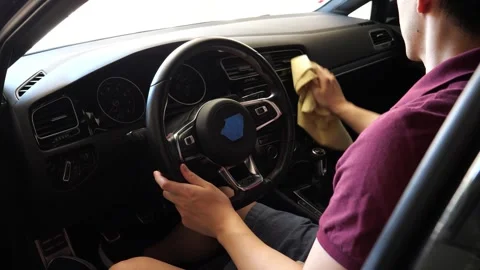 Asian man dusting off and cleaning interior of a car Vidéo 280142729