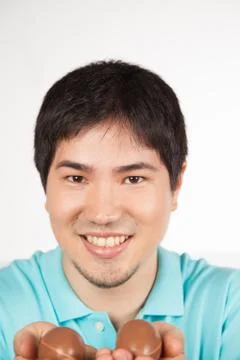 Asian man with easter eggs Stock Photos