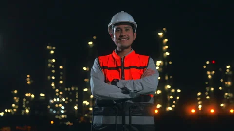 Asian man engineer standing with arms crossed and looking at camera. Video stock 270461283