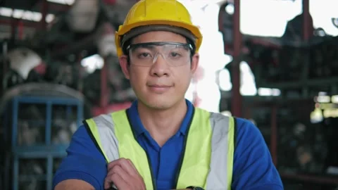 Asian man engineer worker wearing safety uniform look at camera at Factory 스톡 동영상 156387033