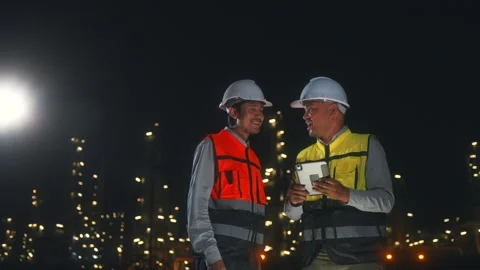 Asian man engineers shaking hands together at petroleum oil refinery. Stock Footage 270460037