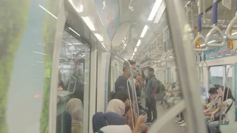 An asian man is entering the mrt. side view. Stock Footage 222033347