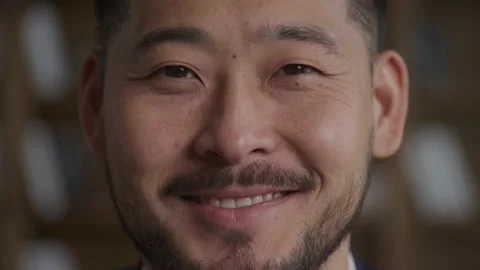 Asian man face close up, smiling and looking at camera Stock Footage 234115338