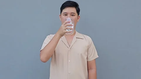 Asian man feel sensitive teeth after drinking cold. Dental health problems... Stock Footage 293652137