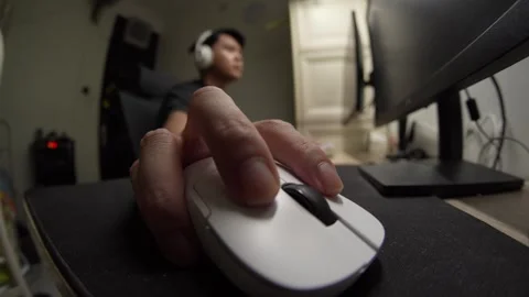 Asian man gaming moving mouse. Close up with fisheye lens Stock Footage 334823879