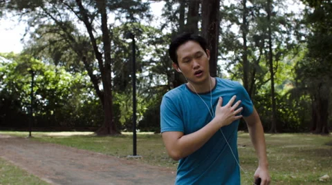 Asian man gets heart attack while exercising Video stock 53082131