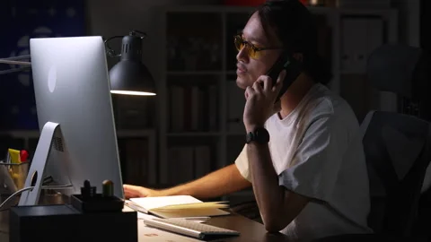 Asian man graphic designer working on computer drawing sketches logo design. Stock Footage 248529357