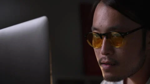 Asian man graphic designer working on computer drawing sketches logo design. Stock Footage 248529960
