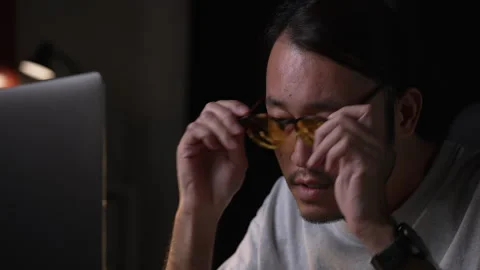 Asian man graphic designer working on computer drawing sketches logo design. Видео 248530722