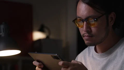 Asian man graphic designer working on computer drawing sketches logo design. Видео 248530982