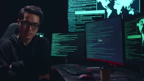 Asian Man Hacker Pose With Code On Multiple Computer Screens Stock-Footage 157497349