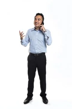 Asian man happy while talking over the phone Foto stock