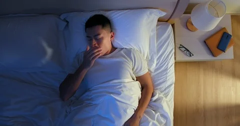 Asian man has insomnia Stock Footage 128669907