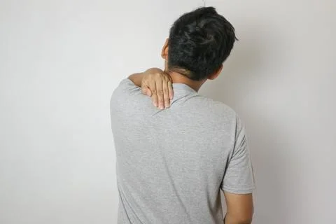 Asian man has problem with structural posture He had neck and back pain. He.. Stock Photos