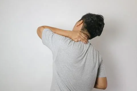 Asian man has problem with structural posture He had neck and back pain. He.. Stock Photos