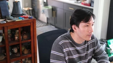 Asian man having a conversation with camera off centered Stock-Footage 318189500