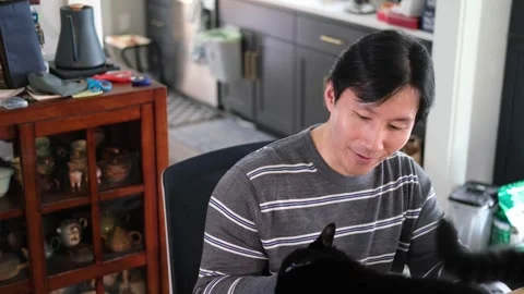 Asian man having a conversation with camera off centered Stock-Footage 318189594