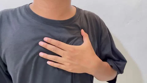 Asian man having heart problems. Asian man having chest pain. Stock Footage 324903333