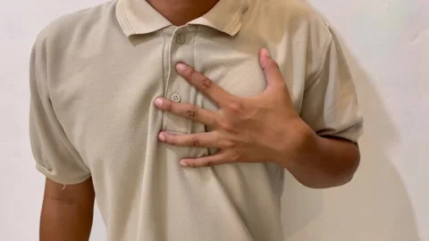 Asian man having heart problems. Asian man having chest pain. Stock Footage 324903343