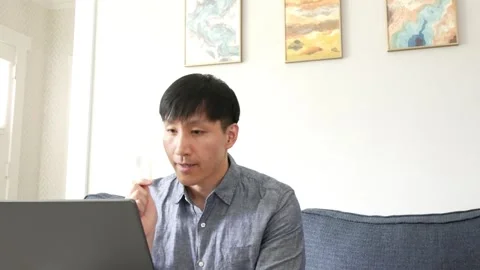 Asian man having an online class with students about milk Stock-Footage 247480063