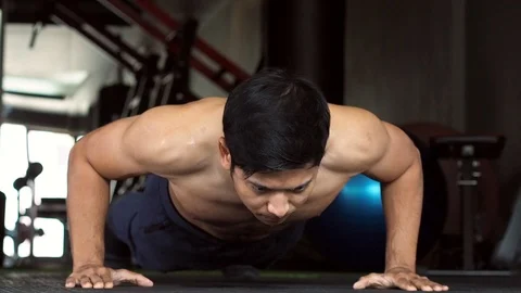 Asian Man Heart Attack When Push Up Workout In Gym. The Man Had A Heart Attack. Stock Footage 106932171