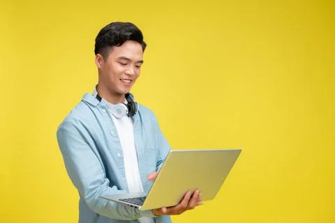 Asian man holding the computer Stock Photos