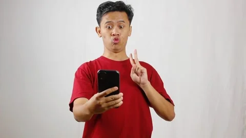 Asian man holding smartphone doing selfie in candid style Stock Footage 319923699