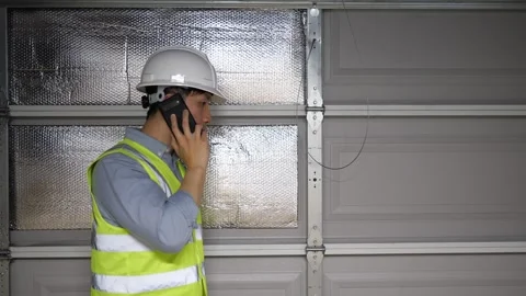 Asian man home inspector checking the structure of a garage Видео 274869201