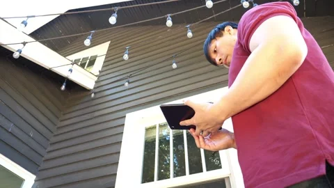 Asian Man home inspector using technology to evaluate and check home Stock Footage 280142698