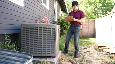 Asian man HVAC technician checking and diagnosing air conditioning unit Stock-Footage 280143091